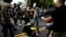 A man hits the pavement during a clash between members of white nationalist protesters against a group of counterprotesters in Charlottesville, Va,, Aug. 12, 2017. 