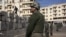 Egyptian army soldiers stand guard in front of the presidential palace, in Cairo, December 9, 2012.