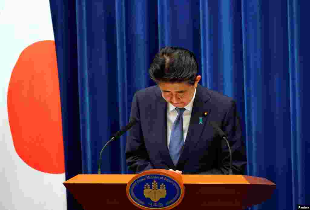 Japanese Prime Minister Shinzo Abe bows during a news conference, where he announced he will resign over health problems, at the prime minister&#39;s official residence in Tokyo, Japan.