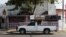 A pick-up truck transports unfinished coffins to another workshop in Jucuapa, El Salvador, April 7, 2016. 
