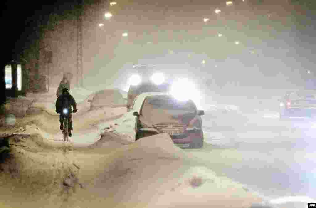 January 6: The streets of Valby Langgade in Copenhagen, Denmark are covered with windswept snow. (AP)