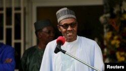 FILE - Nigeria's President Muhammadu Buhari speaks during a news conference after the Summit of Heads of State and Government of The Lake Chad Basin Commission (LCBC) in Abuja, Nigeria, June 11, 2015.