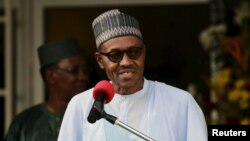 FILE - Nigeria's President Muhammadu Buhari speaks during a news conference after the Summit of Heads of State and Government of The Lake Chad Basin Commission (LCBC) in Abuja, Nigeria, June 11, 2015.