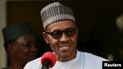 FILE - Nigeria's President Muhammadu Buhari speaks during a news conference after the Summit of Heads of State and Government of The Lake Chad Basin Commission (LCBC) in Abuja, Nigeria, June 11, 2015.