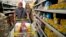 Venezuelan husband and wife Ramiro Ramirez and Tebie Gonzalez shop for food in Cucuta, Colombia, July 17, 2016, during the temporary opening of the border. U.S. firms doing business in Venezuela are adjusting accounting techniques.