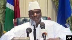 In this image taken from TV, Gambia's longtime leader Yahya Jammeh appears on state TV to give a brief statement agreeing to step down from office, in Banjul, Gambia, in the early hours of Jan. 21, 2017.