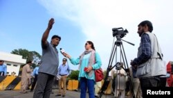 FILE - Journalists work during a demonstration to mark World Press Freedom Day in Islamabad, Pakistan, May 3, 2018. 