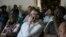 Zimbabweans watch the documentary, "Gukurahundi Genocide: 36 Years Later," during its screening in Harare, Oct. 17, 2018.