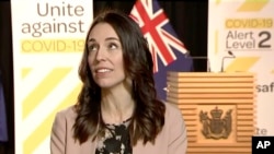In this image made from video, New Zealand Prime Minister Jacinda Ardern looks up when an earthquake struck during a live television interview in Wellington, New Zealand, May 25, 2020.