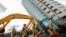 Rescuers work on a search operation at an apartment building that collapsed after a strong earthquake in Hualien County, eastern Taiwan, Feb. 7, 2018. A magnitude 6.4 earthquake struck late Tuesday night caused several buildings to cave in and tilt dangerously.