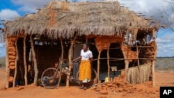 FILE - Salama Masha, a former follower of extremist evangelical leader Paul Mackenzie, stands outside a makeshift house near the scene where dozens of bodies were found in shallow graves in the village of Shakahola in southern Kenya, on Sept. 5, 2024.