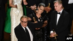 Producers of "Oppenheimer" British film producer Emma Thomas, U.S. film producer Charles Roven and British filmmaker Christopher Nolan accept the award for Best Picture onstage during the 96th Annual Academy Awards at the Dolby Theatre in Hollywood,
