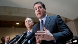 House Intelligence Committee Chairman Rep. Devin Nunes, R-Calif., right, accompanied by the committee's ranking member, Rep. Adam Schiff, D-Calif., talks to reporters, on Capitol Hill in Washington, March, 15, 2017.