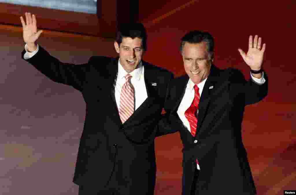 FILE - Republican presidential nominee Mitt Romney, right, and vice presidential running mate Paul Ryan wave after Romney's acceptance speech at the final session of the Republican National Convention in Tampa, Fla., Aug. 30, 2012. 