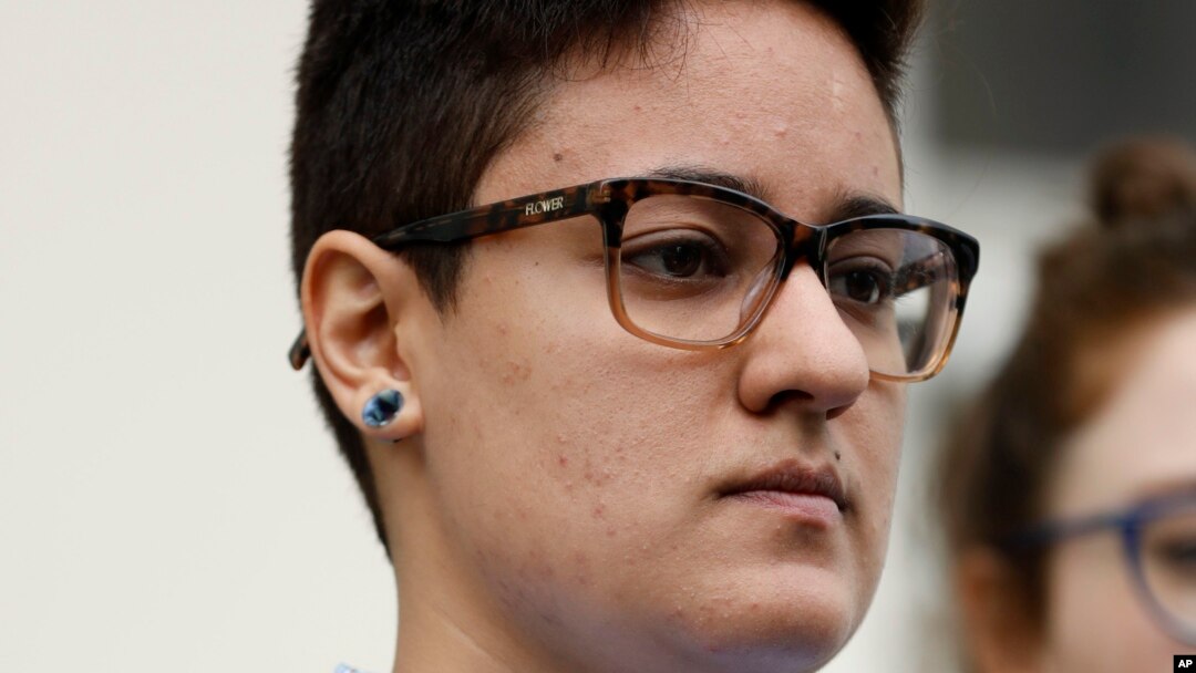 Daniela Vargas, whose father and brother were picked up during a recent immigration raid of undocumented immigrants, listens as speakers discuss the series of raids that also picked up other undocumented immigrants across the state during a news conference in Jackson, Miss., March 1, 2017. Vargas was detained by ICE agents following the news conference.
