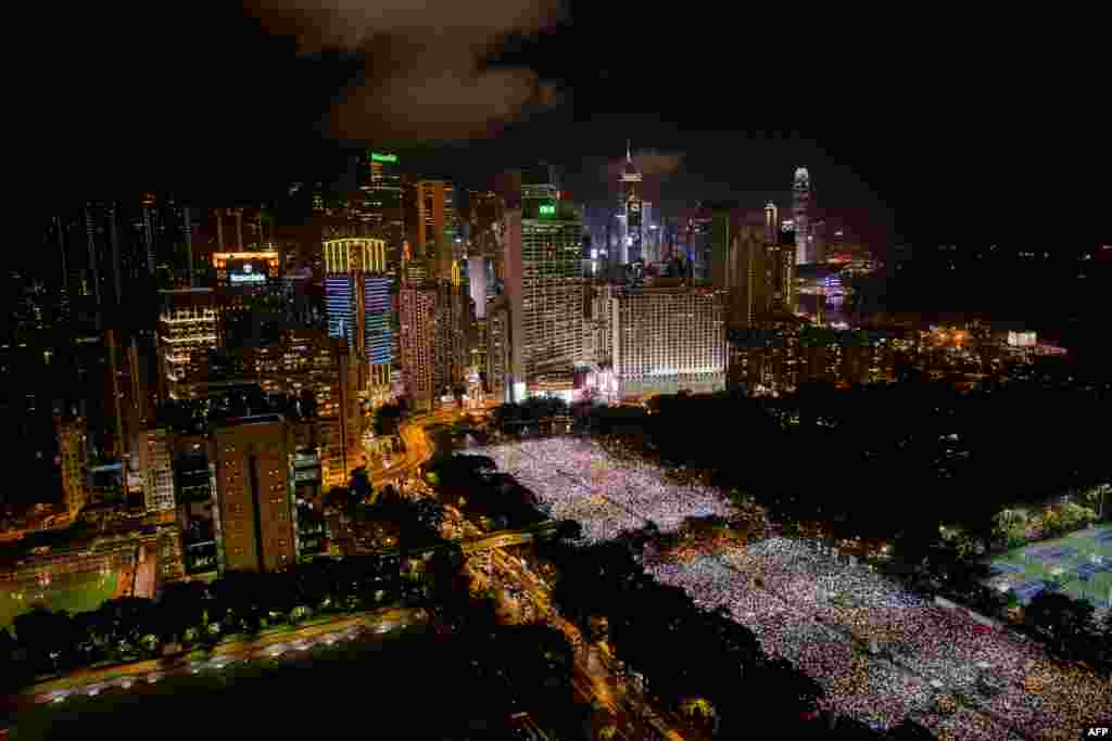 People gather at Victoria Park in Hong Kong during a candlelight vigil held to mark the 24th anniversary of the 1989 crackdown at Tiananmen Square in China.