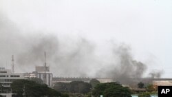 Smoke rises from the city center of Abidjan, April 2, 2011