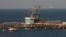 (FILE) Pipelines and a loading berth of the Marsa al Hariga oil port in the city of Tobruk, east of Tripoli, Libya, Aug. 20, 2013.