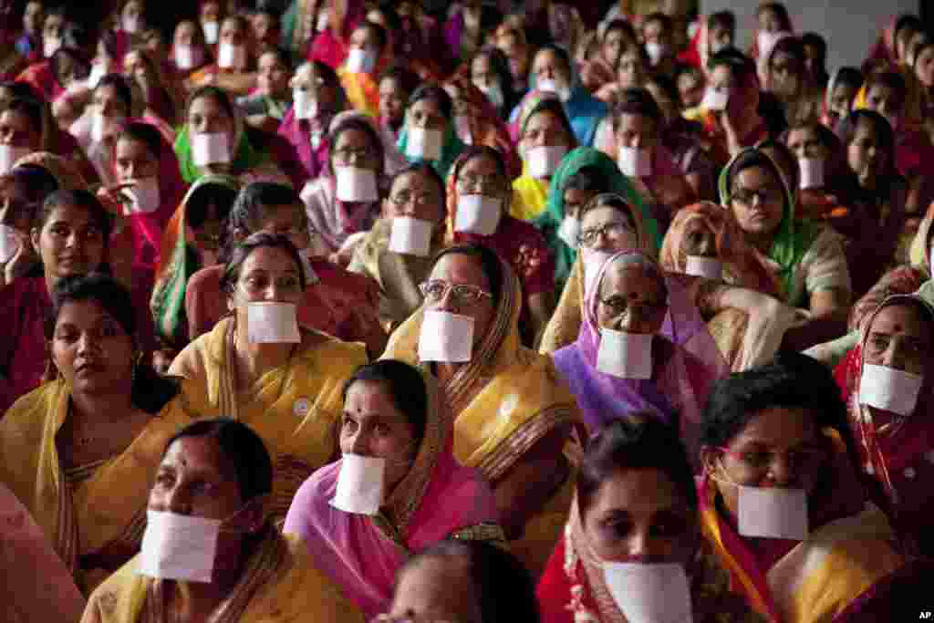 Indian Jain community members gather in support of members of their community who have been on a symbolic “Fasting for world Peace’’ for the past eight days in Hyderabad, India.