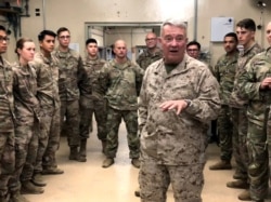 FILE - Marine Gen. Kenneth McKenzie, head of U.S. Central Command, speaks with U.S. troops while visiting Forward Operating Base Fenty in Jalalabad, Afghanistan, Sept. 9, 2019.