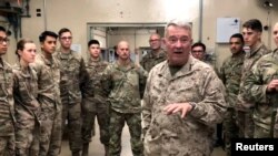 FILE - General Kenneth McKenzie, head of U.S. Central Command, speaks with U.S. troops while visiting Forward Operating Base Fenty in Jalalabad, Afghanistan, September 9, 2019.