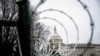 FILE PHOTO: Barbed wire and security fencing surrounds the U.S. Capitol in Washington, Jan. 26, 2021.