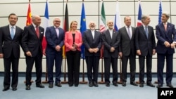 Leaders involved in Iran nuclear talks pose for group photo, July 14, 2015. 