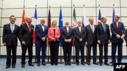 Leaders involved in Iran nuclear talks pose for group photo, July 14, 2015. 