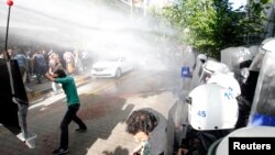 Police use water cannons against protesters as they demonstrate to blame the ruling AK Party (AKP) government for the mining disaster in Soma, a district in Turkey's western province of Manisa, May 16, 2014.