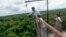 Research assistant Fabian Limonchi checks equipment on a 42-meter observation tower in the Tambopata National Reserve in the Amazon rainforest in Madre de Dios, Dec. 4, 2012.