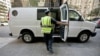 New York City police examines a commercial vehicle at a checkpoint on 59th Street and Park Avenue in Manhattan, New York, September 9, 2011.