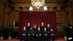 FILE - Members of the Supreme Court pose for a group photo at the Supreme Court in Washington, April 23, 2021.