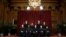 FILE - Members of the Supreme Court pose for a group photo at the Supreme Court in Washington, April 23, 2021.