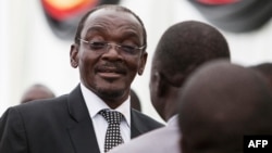 FILE PHOTO - On Dec. 28, 2017, Zimbabwe’s newly appointed vice president Kembo Mohadi reacts as he looks on during the swearing-in ceremony in Harare.