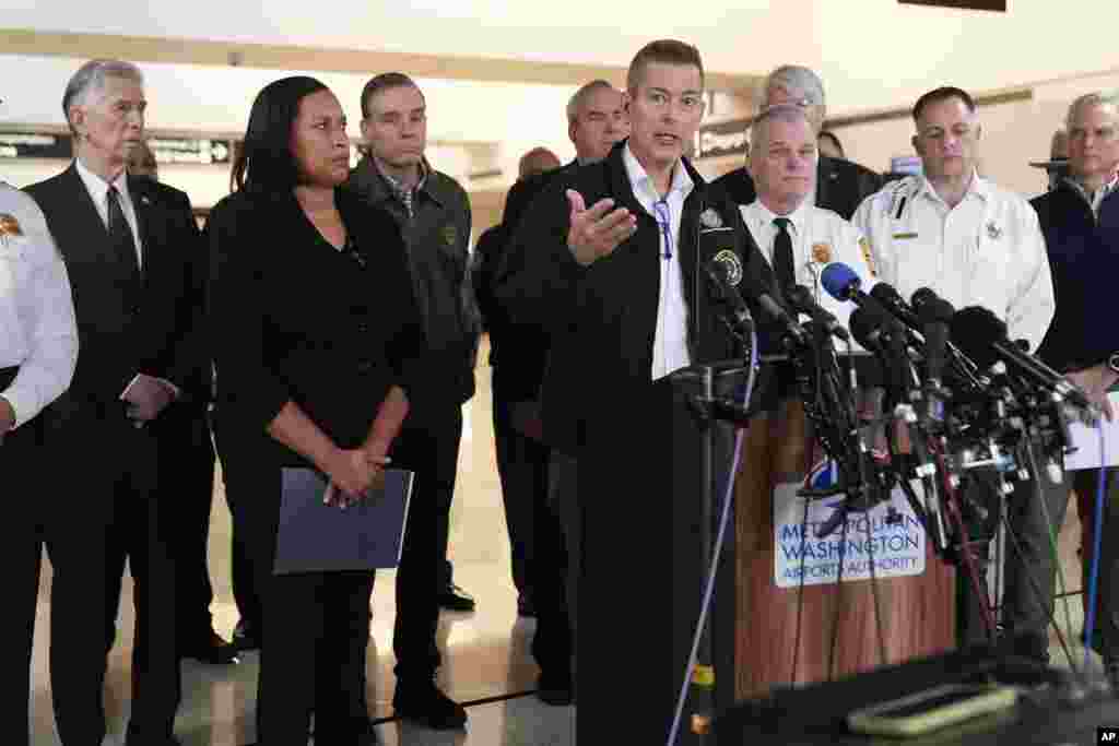 Transportation Secretary Sean Duffy, with District of Columbia Mayor Muriel Bowser, left, and other officials, speaks during a news conference at Ronald Reagan Washington National Airport, Jan. 30, 2025, in Arlington, Virginia.