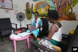 FILE —A Doctors Without Borders clinic staff, left, provides support for a woman who has been sexually assaulted in Bangui, Central African Republic, March 11, 2024.