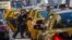 FILE - A woman exits a taxi on Third Avenue in heavy traffic caused by road closures due to high security and official motorcades during the United Nations General Assembly, in New York, Sept. 24, 2013. 
