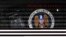 FILE - A mobile phone simulating a call ; a tablet computer showing the logo of the United Staes' National Security Agency (NSA) is seen in this multiple exposure picture. 