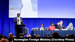 South Sudanese Foreign Minister Barnaba Marial Benjamin gives a speech at the pledging conference for South Sudan in Oslo, Norway on Tuesday, May 20, 2014.