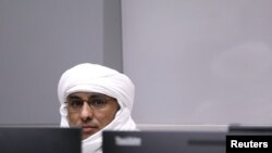 FILE - Malian Islamist militant Al Hassan Ag Abdoul Aziz Ag Mohamed Ag Mahmoud sits in the courtroom of the International Criminal Court during his trial at the Hague, the Netherlands, July 8, 2019. 