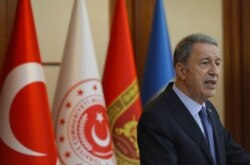 FILE - Turkey's Defense Minister Hulusi Akar speaks to a group of reporters in Ankara, Turkey, May 21, 2019.