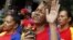 A woman holds a figurine of Venezuelan President Hugo Chavez, as she attends a mass to pray for Chavez's health in Caracas December 11, 2012.