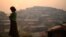 FILE - A Rohingya woman is seen at Balukhali refugee camp at dawn near Cox's Bazaar, Bangladesh, March 28, 2018. 