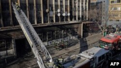 FILE - Firefighters work at the scene of a fire in Johannesburg on August 31, 2023. 