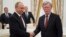 Russian President Vladimir Putin, left, shakes hands with U.S. National security adviser John Bolton during their meeting in the Kremlin in Moscow, Russia, June 27, 2018. 