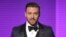 FILE - Justin Timberlake accepts the award for favorite male artist - pop/rock at the American Music Awards at the Nokia Theater L.A. Live on Nov. 24, 2013, in Los Angeles. 