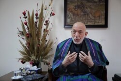 FILE - Former Afghan President Hamid Karzai speaks during an interview in Kabul, Afghanistan, Dec. 10, 2019.