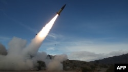 FILE - This handout photo courtesy of the U.S. Department of Defense taken on Dec. 14, 2021 shows the U.S. Army conducting live fire tests of the Army Tactical Missile System (ATACMS) at the White Sands Missile Range in New Mexico.