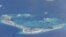Chinese dredging vessels are purportedly seen in the waters around Mischief Reef in the disputed Spratly Islands in the South China Sea, May 21, 2015.