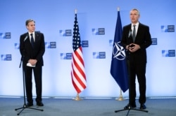 NATO Secretary-General Jens Stoltenberg, right, and United States Secretary of State Antony Blinken address the media at NATO headquarters in Brussels, Belgium, Apr. 14, 2021.